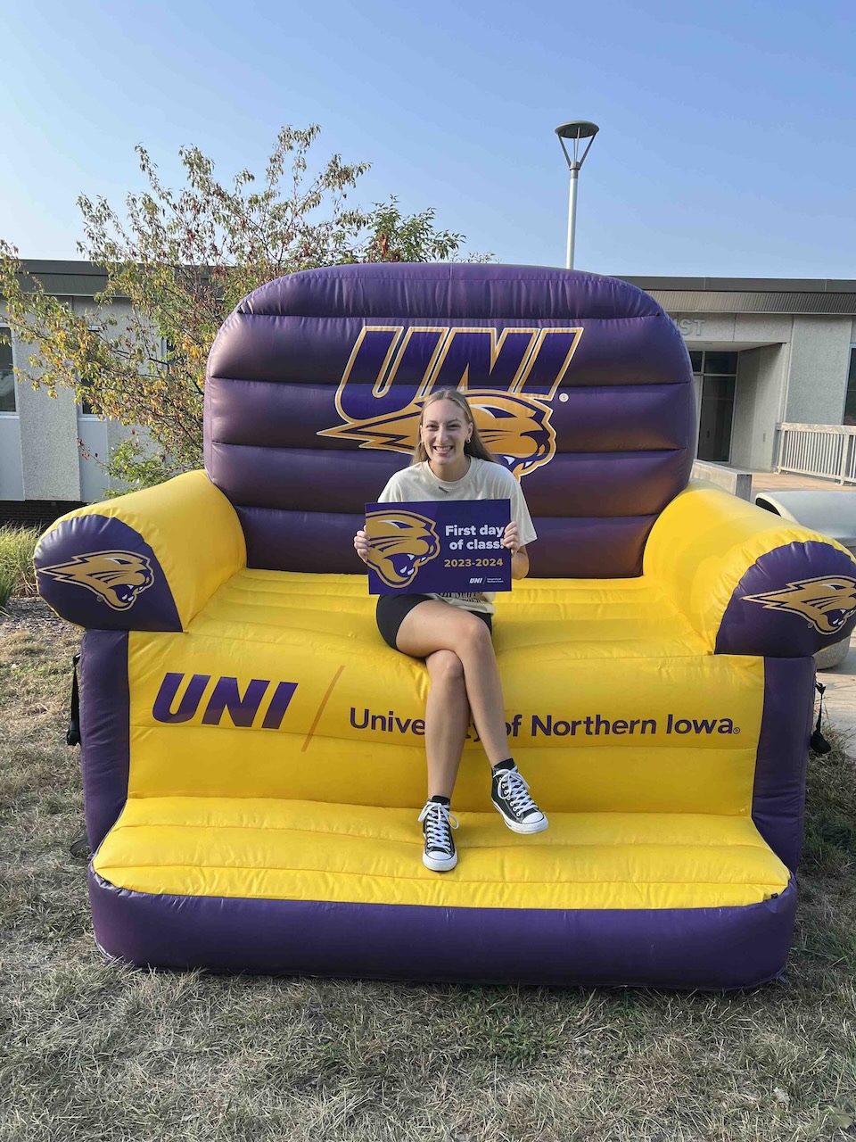 Elizabeth Pischke sitting in purple and gold chair