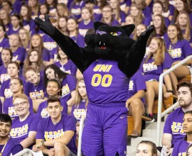 TC pumping up the student section in the McLeod Center.