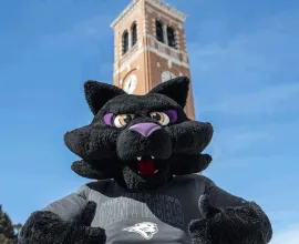 TC giving a thumbs up in front of the campanile.